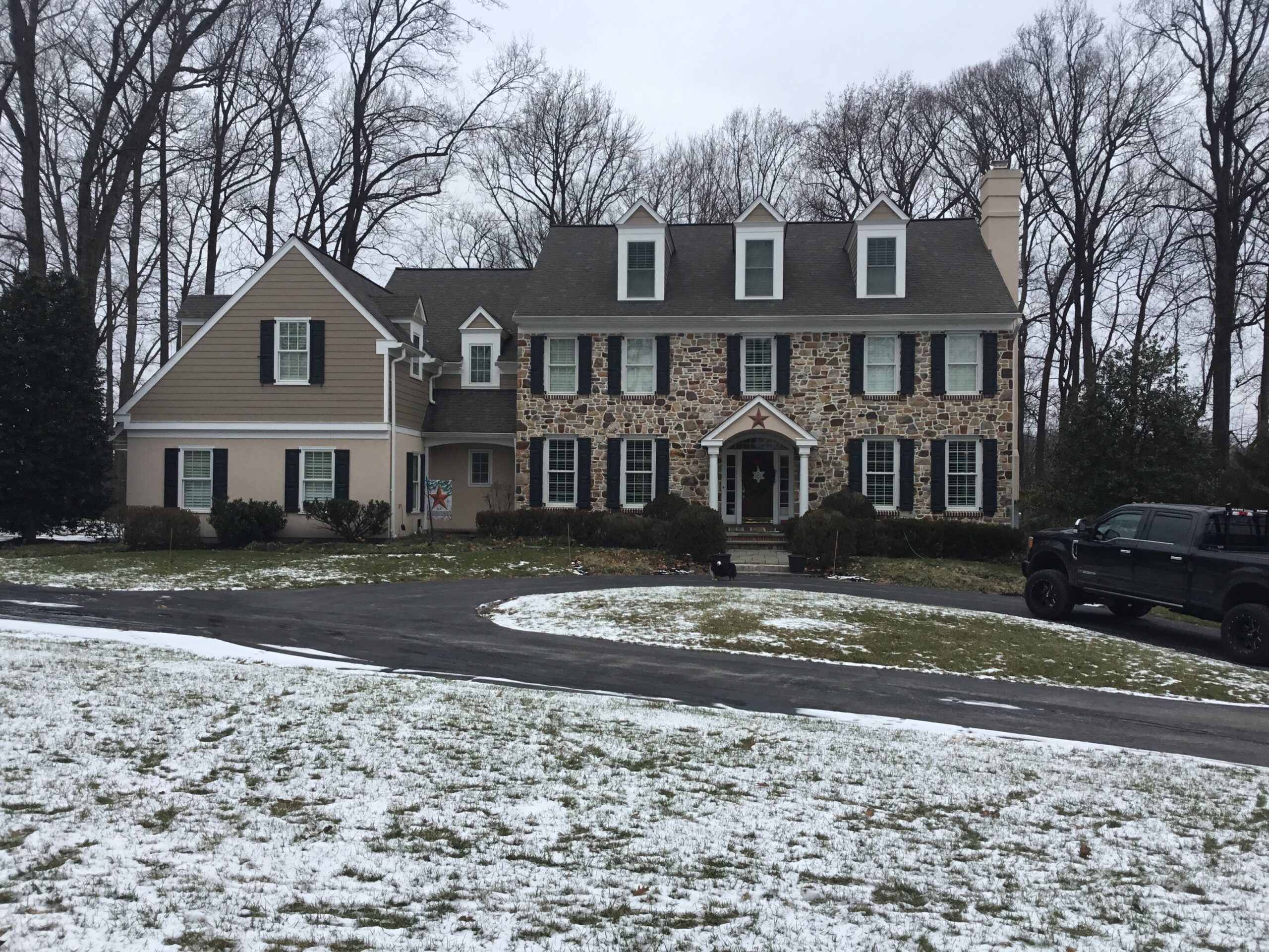 Large home with snow on ground